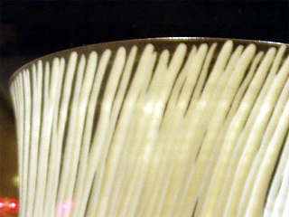 A close up of one of Irit Abba's carved cylinders