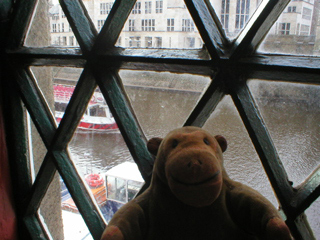 Mr Monkey watching a tour boat from a cafe on Lendal Bridge