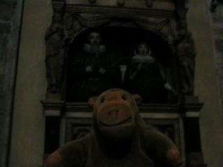 Mr Monkey looking at a monument in the quire aisle