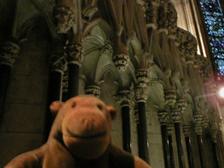 Mr Monkey looking at carved heads in the Chapter House