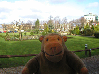 Mr Monkey looking at the gardens outside the hotel