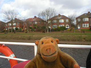 Mr Monkey looking at houses along the river