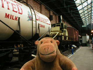 Mr Monkey looking at a row of freight stock