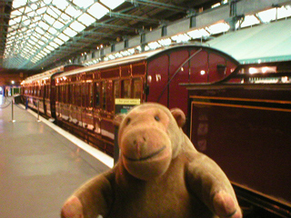 Mr Monkey looking at Midland Railway carriages