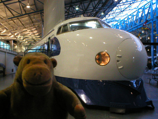 Mr Monkey looking at the Shinkansen Bullet Train