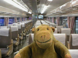 Mr Monkey in the passenger compartment of the Shinkansen