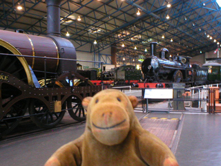 Mr Monkey looking at locomotives on and around the turntable