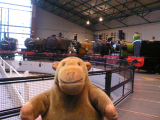 Mr Monkey looking at locomotives around the turntable