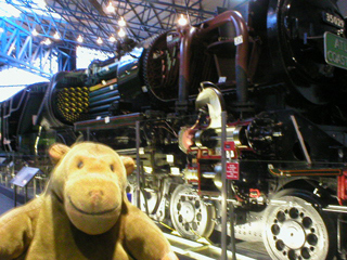Mr Monkey looking at a sectioned locomotive