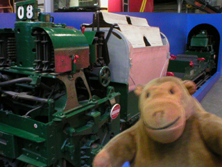 Mr Monkey looking at a Royal Mail underground train