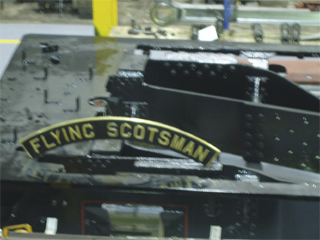 The nameplate of the Flying Scotsman resting on the chassis
