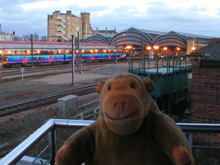 Mr Monkey looking across the tracks to York station