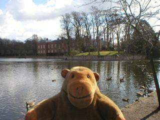 Mr Monkey looking at the Hall across the moat