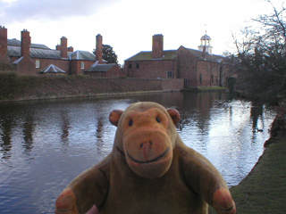 Mr Monkey looking at the service wing and stable block