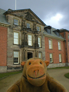 Mr Monkey scampering towards the front door of the house 