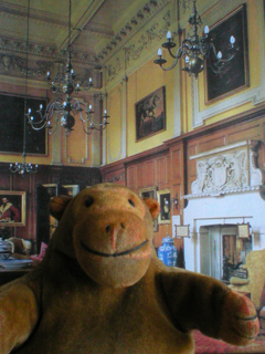Mr Monkey in front of a picture of the Great Hall