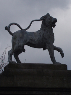 One of the lions outside the house