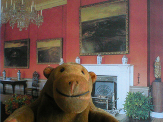 Mr Monkey in front of a picture of the of the Great Gallery