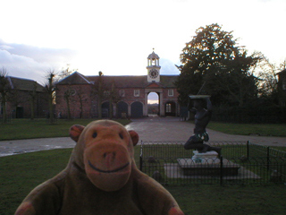 Mr Monkey looking towards the stable block at dusk