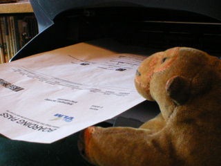 Mr Monkey printing out his boarding cards