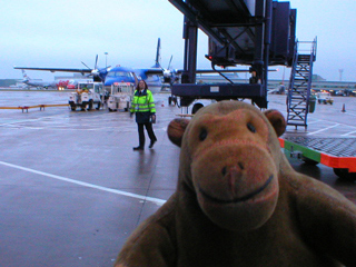 Mr Monkey walking out to his plane on the tarmac at Ringway