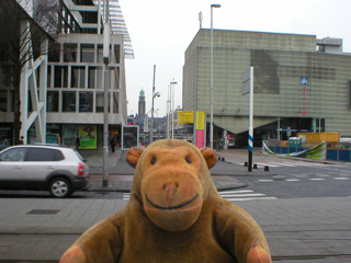 Mr Monkey looking down a long street to the Stadhuis