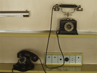 The two telephones in the parent's bedroom