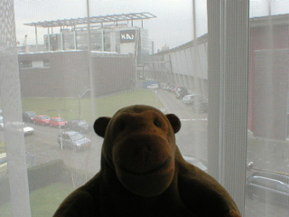 Mr Monkey looking out of the dressing room window North Quire Aisle