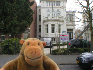 Mr Monkey checking stock prices on an LED display