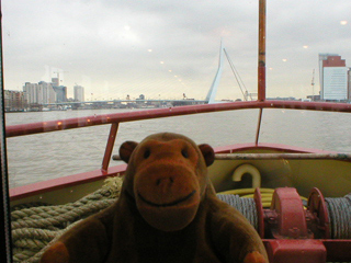 Mr Monkey looking towards the Erasmusbrug from the boat