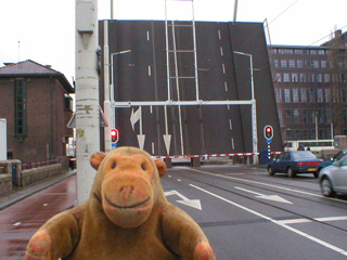 Mr Monkey looking at a raised road bridge