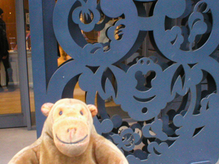 Mr Monkey examining the screens outside the Centre