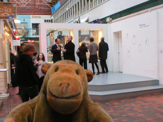 Mr Monkey looking at people looking at the exhibition