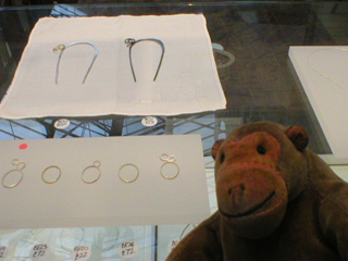 Mr Monkey looking at metal rings by Beth Essex
