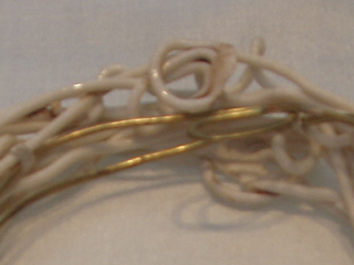 Detail of the metal and porcelain bracelet