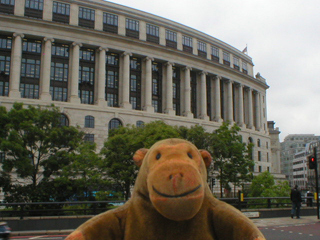 Mr Monkey looking at the Unilever building from Blackfriars bridge