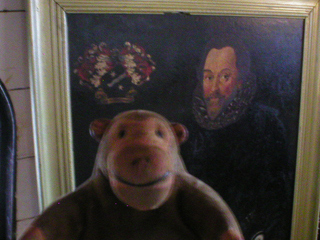 Mr Monkey looking at a painting of Sir Francis Drake