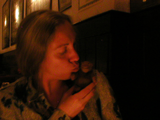 Mr Monkey getting a kiss from Kat Richardson at Pizza Paradiso