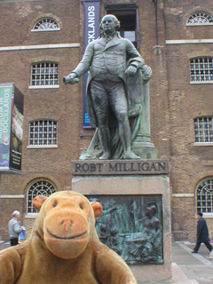 Mr Monkey looking at the statue of Robert Milligan
