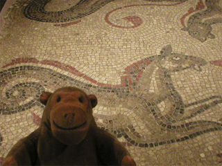 Mr Monkey looking at a Roman mosaic