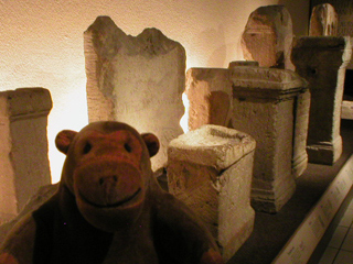 Mr Monkey looking at Roman tombstones