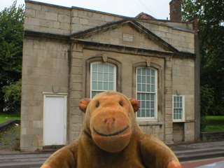 Mr Monkey looking at the Redcliffe Way frontage of Chatterton's birthplace