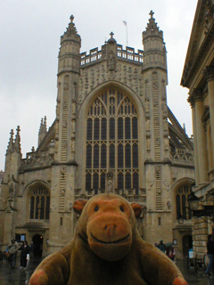 Mr Monkey looking at the front of Bath Abbey