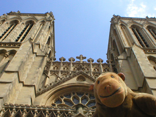 Mr Monkey looking up at the west front of Bristol Cathedral