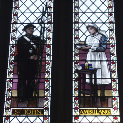 St. John Ambulance - a man with a metal stretcher and a nurse with a bowl St. John Ambulance - a man with a metal stretcher and a nurse with a bowl