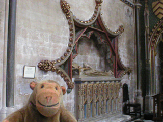 Mr Monkey looking at the tomb of an abbot