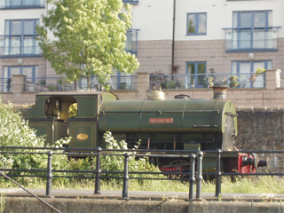 A tank engine steaming along the quayside