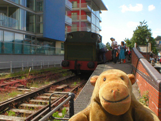 Mr Monkey looking at a small platform and a tank engine