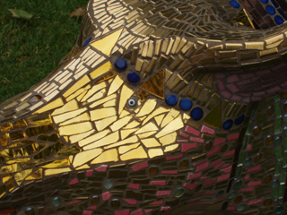 Gold mosaic pieces on the face of Prince Ropork