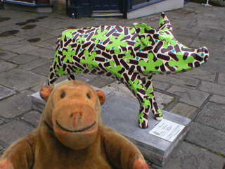 Mr Monkey looking at The Nº1 Pig